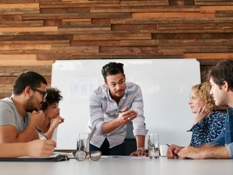 A group of people in a meeting.